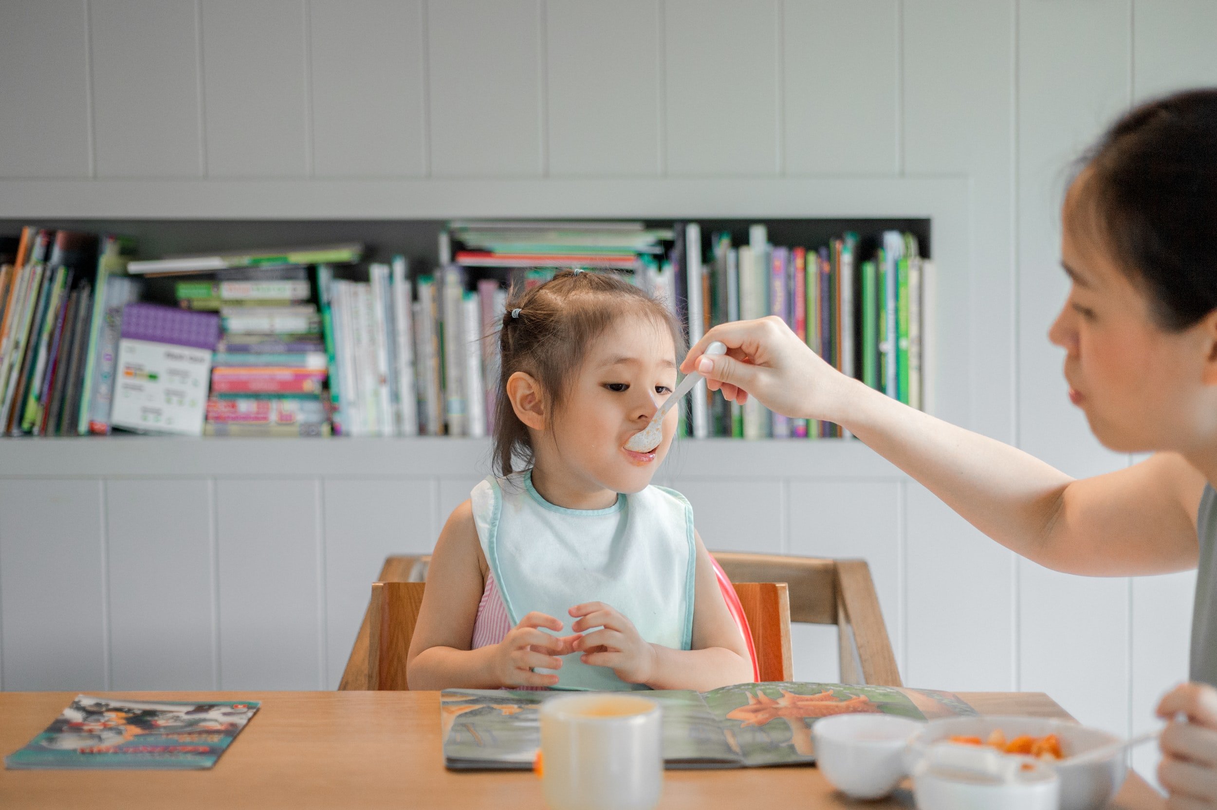 mother feeding a child